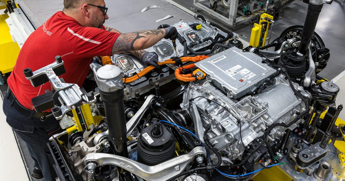 German automotive factory with flags and industrial landscape